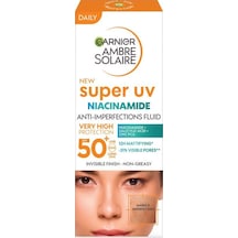 Garnier Ambre Solaire Super Uv Niasinamid Cilt Kusurları Karşıtı Günlük Güneş Koruyucu Fluid Krem SPF50+ 40 ML