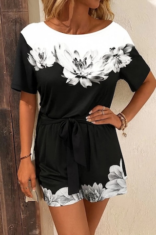 Defymoda Kadın Tek Omuzu Açık Çiçek Desenli Beli Kuşaklı Iki Iplik Mini Short Tulum Siyah
