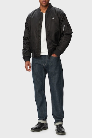 Calvin Klein Logolu Relaxed Fit Kolej Yaka Su İtici Mont Lv04rg505gub1 Erkek Mont Lv04rg505g Ub1 Siyah