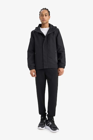 Defacto Defactofit Su İtici Regular Fit Kapüşonlu Fermuarlı Yağmurluk C6047ax25aubk81 Siyah
