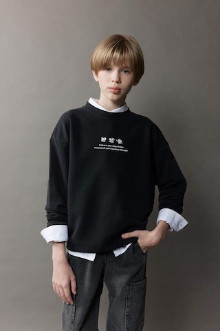 DeFacto Erkek Çocuk Oversize Geniş Kalıp Bisiklet Yaka Sırt Baskılı Yıkamalı Soluk Efektli Sweatshirt D8494A825SPBK81