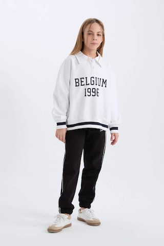 DeFacto Kız Çocuk Oversize Geniş Kalıp Polo Yaka Baskılı İçi Yumuşak Tüylü Sweatshirt D3497A824WNWT34 Beyaz