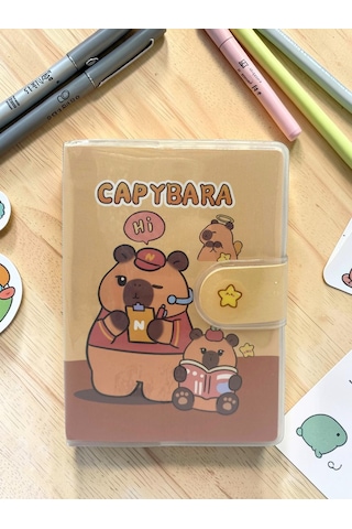 Capybara A7 Not Defteri , Çıt Çıtlı Cep Defteri - Kitap Okuyan Capybara Sarı