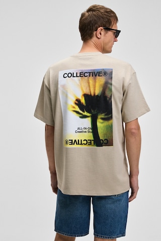 Grimelange COLLECTIVE Erkek Ön Nakış Arka Baskı Detaylı %100 Organik Pamuk Oversize Kısa Kol Taş Rengi T-Shirt