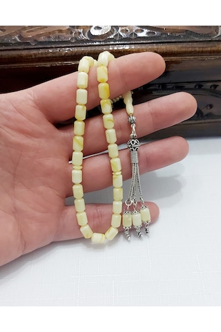 Damla Kehribar Kapsül Kesim Gümüş Püsküllü Tesbih... Damla Gr : 7,7 Gümüş Gr : 3,2 Ölçü : 5,5 X 8 Sarı - Beyaz