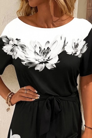 Defymoda Kadın Tek Omuzu Açık Çiçek Desenli Beli Kuşaklı Iki Iplik Mini Short Tulum Siyah