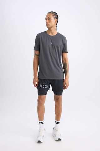 DeFactoFit Slim Fit Dar Kesim Fermuarlı Telefon Cepli Sporcu Taytlı Şort Z2147AZ25SPBK81