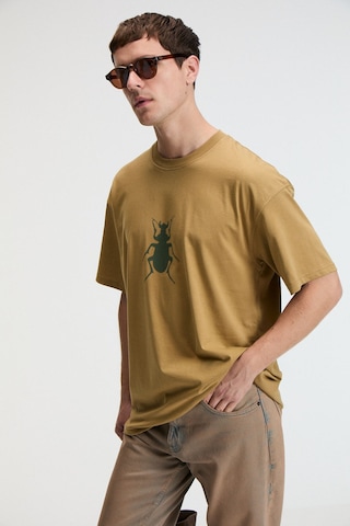 Grimelange BOLD Erkek %100 Pamuk Oversize Fit Baskılı Kısa Kollu Yuvarlak Yakalı Koyu Bej T-Shirt