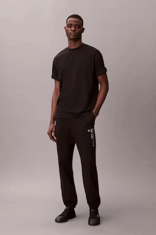 Calvin Klein Havlu Kumaş Calvin 1968 Grafikli Erkek Siyah Eşofman Altı Lv14rf248g-ub1 Siyah