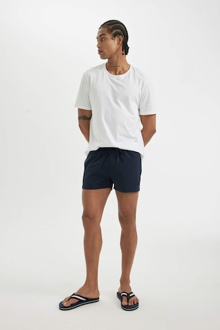 DeFactoFit Andy Baskılı Esnek Dokulu Kısa Boy Sporcu Deniz Şortu B5987AX24HSNV146 Lacivert