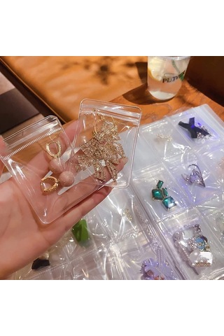 Anjiexun 84 Izgaralı Şeffaf Mücevher Saklama Defteri Ve 50 Parça Fermuarlı Çanta Şeffaf