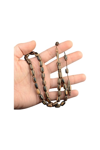 Kapsül Kesim 11x7 Mm Kafur Ağacı Sistem Püsküllü Tesbih Kahverengi Kapsül Kesim 11x7 Mm Kafur Ağacı Sistem Püsküllü Tesbih Kahverengi