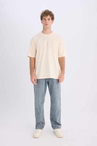 DeFacto Avatar the Last Airbender Boxy Fit Bisiklet Yaka Sırt Baskılı Kısa Kollu Tişört D6776AX25SPER83 Ekru