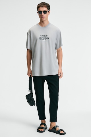 Grimelange FEAST Erkek %100 Pamuk Oversize Fit Baskılı Kısa Kollu Yuvarlak Yakalı Açık Gri T-Shirt