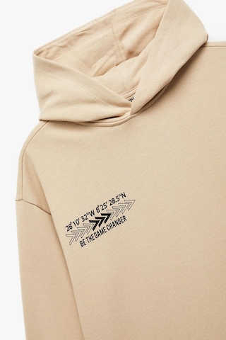 Koton Erkek Çocuk Şardonlu Uzun Kollu Pamuklu Baskılı Oversize Kapşonlu Sweatshirt Bej