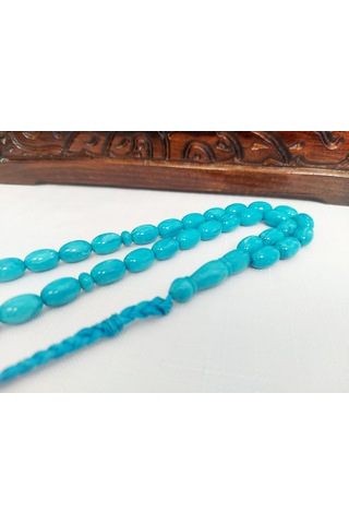 Turkuaz Renginde Örgülü Püskül Modelli Katalin...