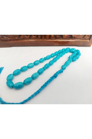 Turkuaz Renginde Örgülü Püskül Modelli Katalin...