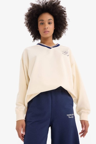 DeFactoFit Oversize Geniş Kalıp V Yaka Baskılı Sporcu Kadın Sweatshirt - Ekru D7135AX25SPER109