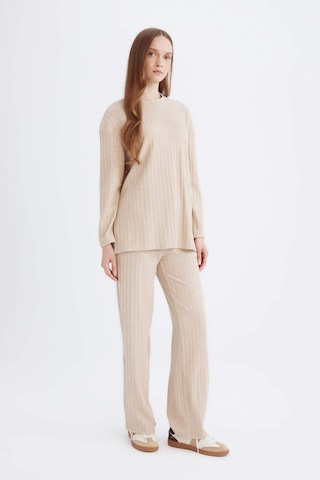 DeFacto Regular Beli Lastikli Basic Düz Fit Fitilli Kaşkorse Geniş Paça Pantolon D7437AX24WNBG775 Bej