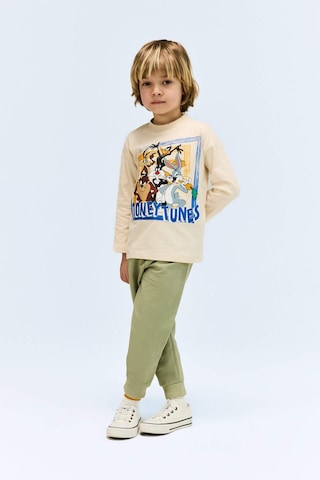 DeFacto Erkek Bebek Looney Tunes Bisiklet Yaka Uzun Kollu Tişört E4708A525SPBG319 Bej