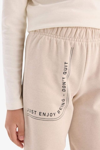 DeFacto Kız Çocuk Baskılı Beli Paçası Lastikli Jogger Eşofman Altı D7012A824WNBG186 Bej