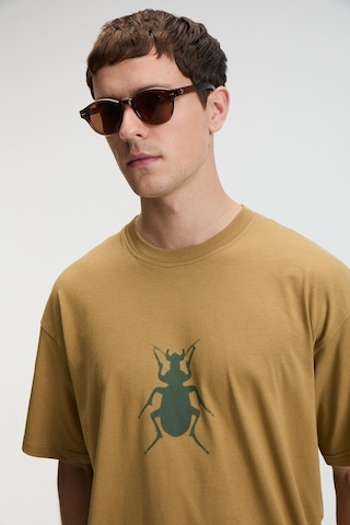 Grimelange BOLD Erkek %100 Pamuk Oversize Fit Baskılı Kısa Kollu Yuvarlak Yakalı Koyu Bej T-Shirt