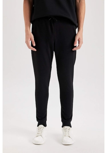 DeFacto Jogger Eşofman Altı Slim Fit Dar Kesim Beli Bağcıklı Lastikli Paça Fermuar Cepli A4387AX24AUBK81 DeFacto Jogger Eşofman Altı Slim Fit Dar Kesim Beli Bağcıklı Lastikli Paça Fermuar Cepli A4387AX24AUBK81