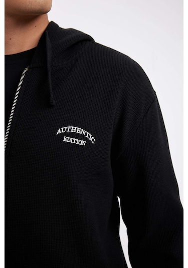 DeFacto Siyah Relax Fit Kapüşonlu Waffle Baskılı Cepli Fermuarlı Sweatshirt D2629AX24AUBK81 DeFacto Siyah Relax Fit Kapüşonlu Waffle Baskılı Cepli Fermuarlı Sweatshirt D2629AX24AUBK81