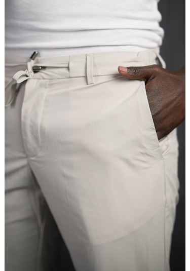 Beli Lastikli Ve İplikli Likralı Yazlık İnce Paraşüt Kumaş Jogger Pantolon Krem