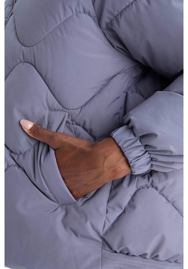 Defacto Defactofit Su İtici Oversize Fit Geniş Kalıp Kapüşonlu Fermuarlı Cepli Şişme Mont E9260ax25aupr492 Mor-pr492