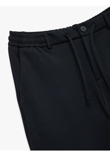 Koton Beli Bağcıklı Düğmeli Pike Kumaş Cep Detaylı Duble Paça Slim Fit Pantolon Lacivert 6wam40012hk Lacivert