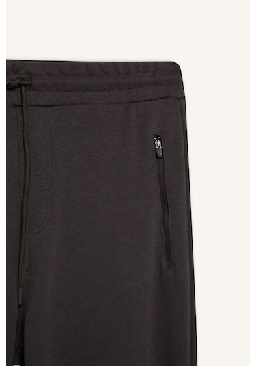 DeFacto Jogger Eşofman Altı Slim Fit Dar Kesim Beli Bağcıklı Lastikli Paça Fermuar Cepli A4387AX24AUAR227 DeFacto Jogger Eşofman Altı Slim Fit Dar Kesim Beli Bağcıklı Lastikli Paça Fermuar Cepli A4387AX24AUAR227