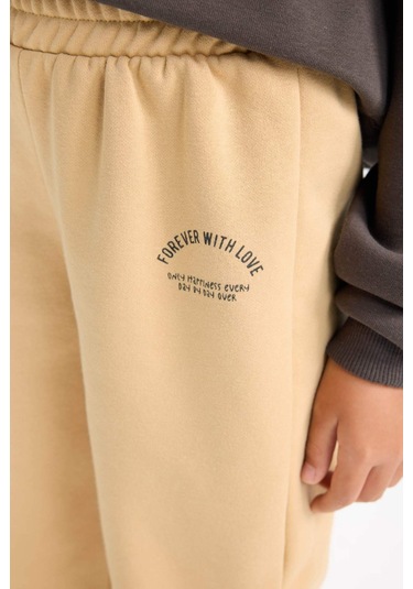 DeFacto Kız Çocuk Standart Fit Beli Paçası Lastikli Baskılı Jogger Eşofman Altı D2295A824WNBG68 Bej DeFacto Kız Çocuk Standart Fit Beli Paçası Lastikli Baskılı Jogger Eşofman Altı D2295A824WNBG68 Bej