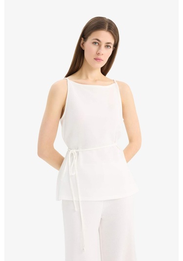 DeFacto Regular Fit Kayık Yaka Bağcıklı Pike Kolsuz Bluz E5778AX25SPWT47 DeFacto Regular Fit Kayık Yaka Bağcıklı Pike Kolsuz Bluz E5778AX25SPWT47