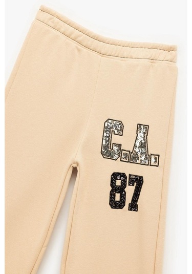 Koton Kız Çocuk Şardonlu Pullu Payetli Pamuklu Beli Lastikli Geniş Paça Eşofman Altı Bej