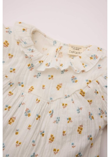 DeFacto Kız Bebek Müslin Çiçek Desenli Fırfırlı Yaka Uzun Kollu Gömlek D8764A524WNER105 Ekru DeFacto Kız Bebek Müslin Çiçek Desenli Fırfırlı Yaka Uzun Kollu Gömlek D8764A524WNER105 Ekru