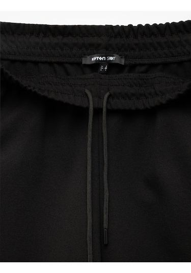 Koton Viskon Karışımlı Beli Bağcıklı Baskılı Bermuda Oversize Spor Şort Siyah 5sam40023nk Siyah Koton Viskon Karışımlı Beli Bağcıklı Baskılı Bermuda Oversize Spor Şort Siyah 5sam40023nk Siyah