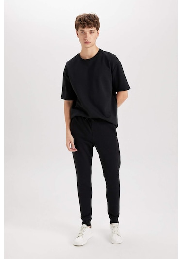 DeFacto Jogger Eşofman Altı Slim Fit Dar Kesim Beli Bağcıklı Lastikli Paça Fermuar Cepli A4387AX24AUBK81 DeFacto Jogger Eşofman Altı Slim Fit Dar Kesim Beli Bağcıklı Lastikli Paça Fermuar Cepli A4387AX24AUBK81