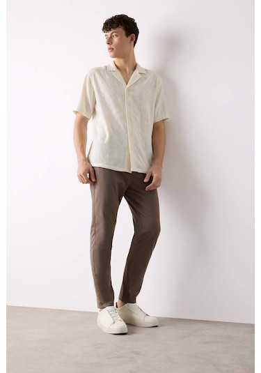 DeFacto %100 Pamuk Keten Görünümlü Yazlık Jogger Pantolon Dar Paça Beli Bağcıklı Lastikli Cepli Z6475AZ25SPBN571 DeFacto %100 Pamuk Keten Görünümlü Yazlık Jogger Pantolon Dar Paça Beli Bağcıklı Lastikli Cepli Z6475AZ25SPBN571