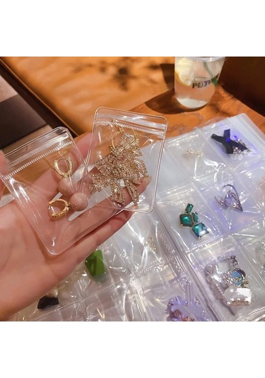 Anjiexun 84 Izgaralı Şeffaf Mücevher Saklama Defteri Ve 50 Parça Fermuarlı Çanta Şeffaf