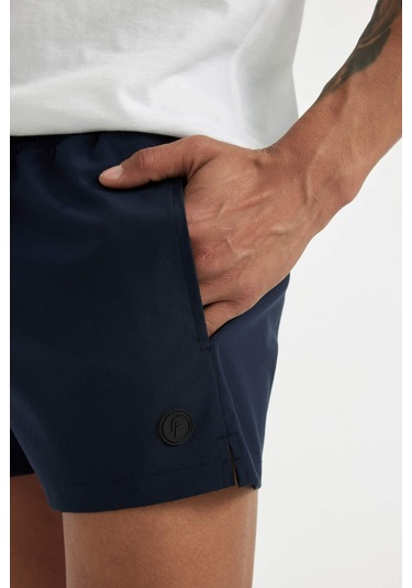 DeFactoFit Andy Baskılı Esnek Dokulu Kısa Boy Sporcu Deniz Şortu B5987AX24HSNV146 Lacivert