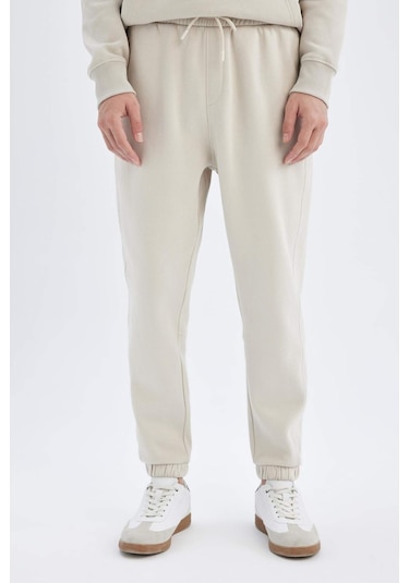 DeFacto Regular Fit Eşofman Altı Cepli Beli Bağcıklı Lastikli Paça B6155AX24AUBG766 Bej DeFacto Regular Fit Eşofman Altı Cepli Beli Bağcıklı Lastikli Paça B6155AX24AUBG766 Bej