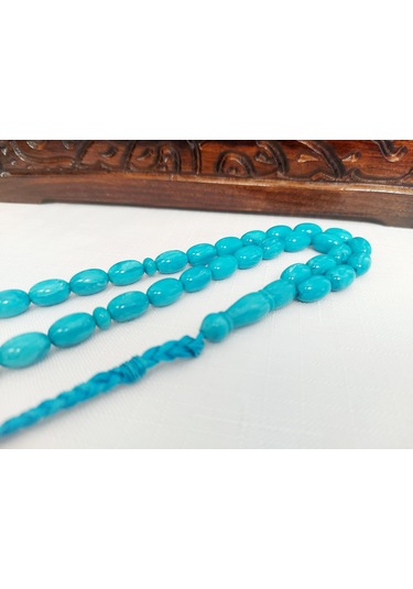 Turkuaz Renginde Örgülü Püskül Modelli Katalin...