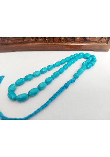 Turkuaz Renginde Örgülü Püskül Modelli Katalin...