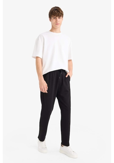 Defacto Regular Fit Basic Düz Beli Bağcıklı Düz Paça Cepli Eşofman Altı D6762AX24AU Siyah Defacto Regular Fit Basic Düz Beli Bağcıklı Düz Paça Cepli Eşofman Altı D6762AX24AU Siyah