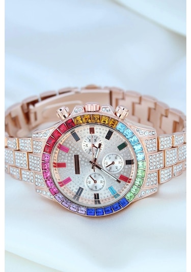 Clariss Trend Rose Metal Kordonlu Zirkon Taş Kaplama Renkli Taşlı Kasa Tasarımlı Lüx Kadın Kol Saati Gold