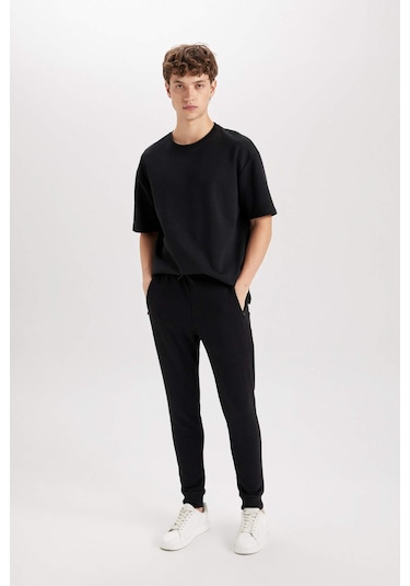 DeFacto Jogger Eşofman Altı Slim Fit Dar Kesim Beli Bağcıklı Lastikli Paça Fermuar Cepli A4387AX24AUBK81 DeFacto Jogger Eşofman Altı Slim Fit Dar Kesim Beli Bağcıklı Lastikli Paça Fermuar Cepli A4387AX24AUBK81