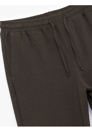 Koton Viskon Karışımlı Cep Detaylı Dokulu Beli Bağcıklı Pantolon Kahverengi 6wam40089hw Kahve