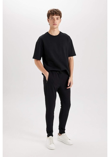 DeFacto Jogger Eşofman Altı Slim Fit Dar Kesim Beli Bağcıklı Lastikli Paça Fermuar Cepli A4387AX24AUBK81 DeFacto Jogger Eşofman Altı Slim Fit Dar Kesim Beli Bağcıklı Lastikli Paça Fermuar Cepli A4387AX24AUBK81