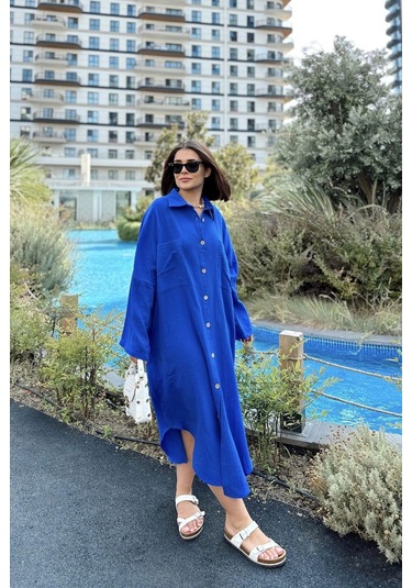 Kadın Saks Muslin Kumaş, Yarasa Kol, Eteği Oval, Çift Cepli, Uzun Oversize Salaş Gömlek Elbise Saks Kadın Saks Muslin Kumaş, Yarasa Kol, Eteği Oval, Çift Cepli, Uzun Oversize Salaş Gömlek Elbise Saks